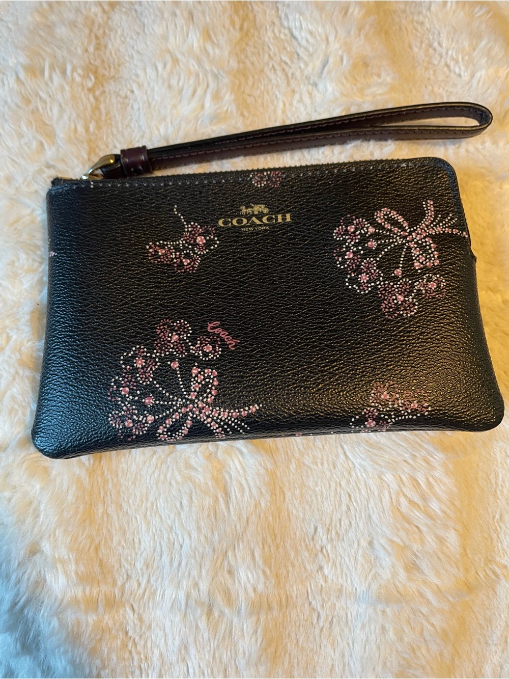 Coach Black Pebbled Leather Wristlet with Pink Floral Bow Motif